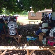 The project veterinary technician providing guidance on constructing recommended pig kraal for a No hunger group